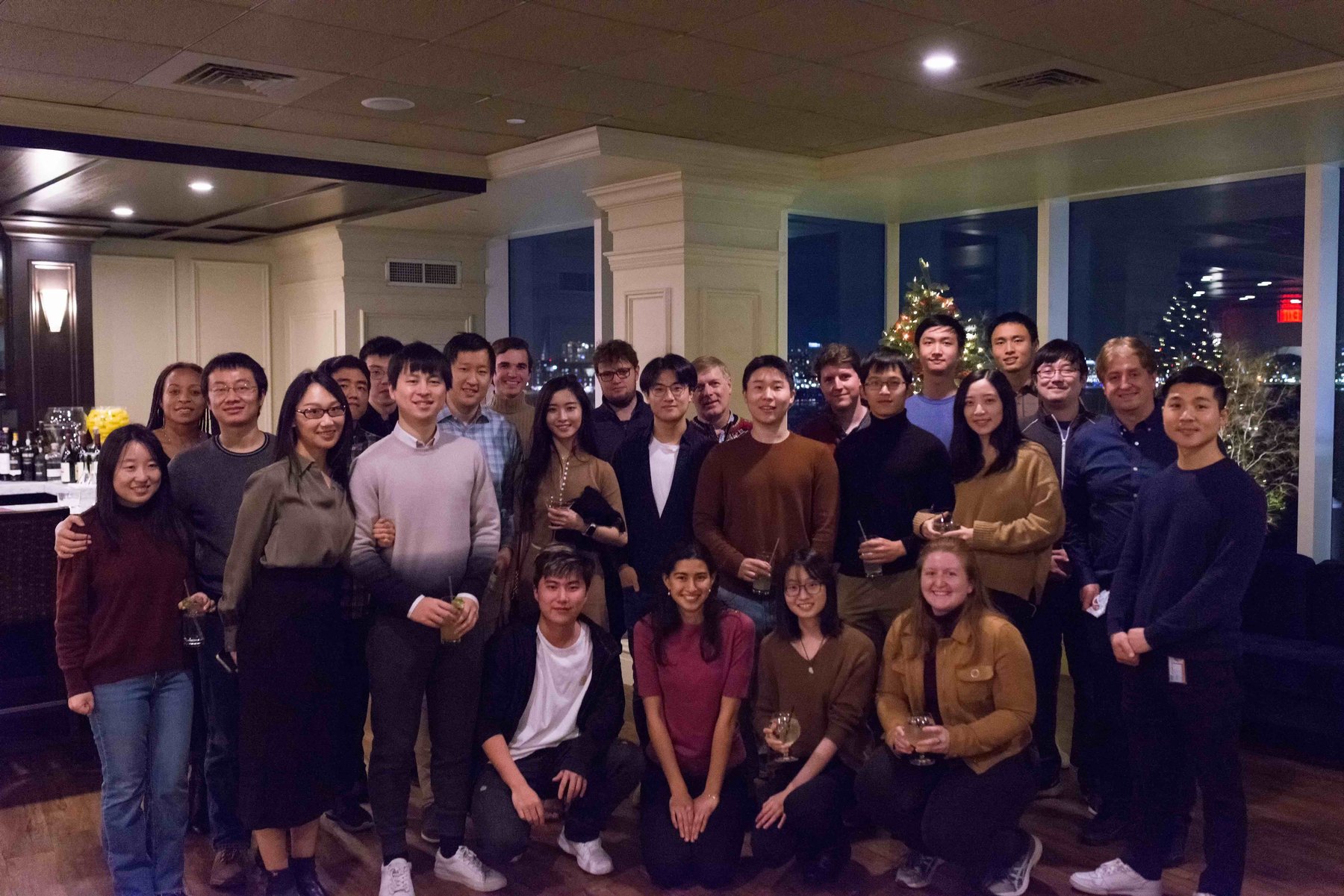 About thirty group members and alumni gathered at the December 2021 holiday party